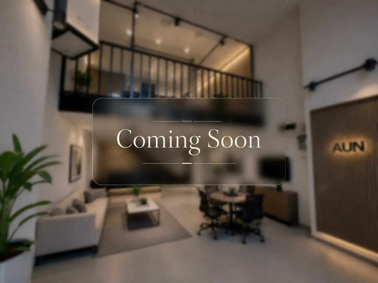 Blurred inside view of the AUN Tech office and demo space under preparation.